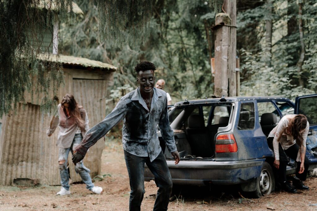 zombies near an abandoned car